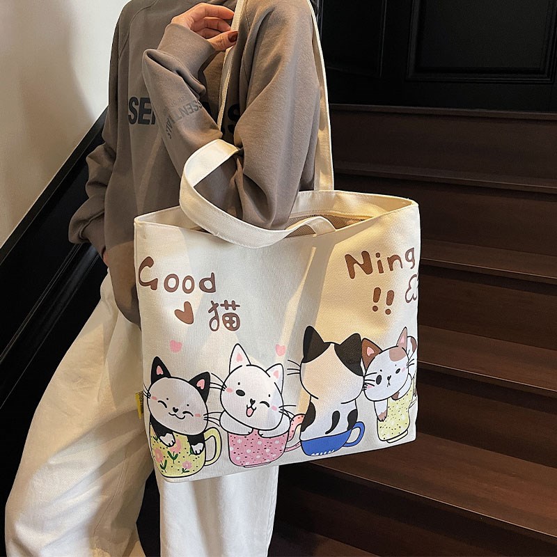 日系卡通帆布包女2025新款休闲大容量通勤包手提购物袋上课托特包
