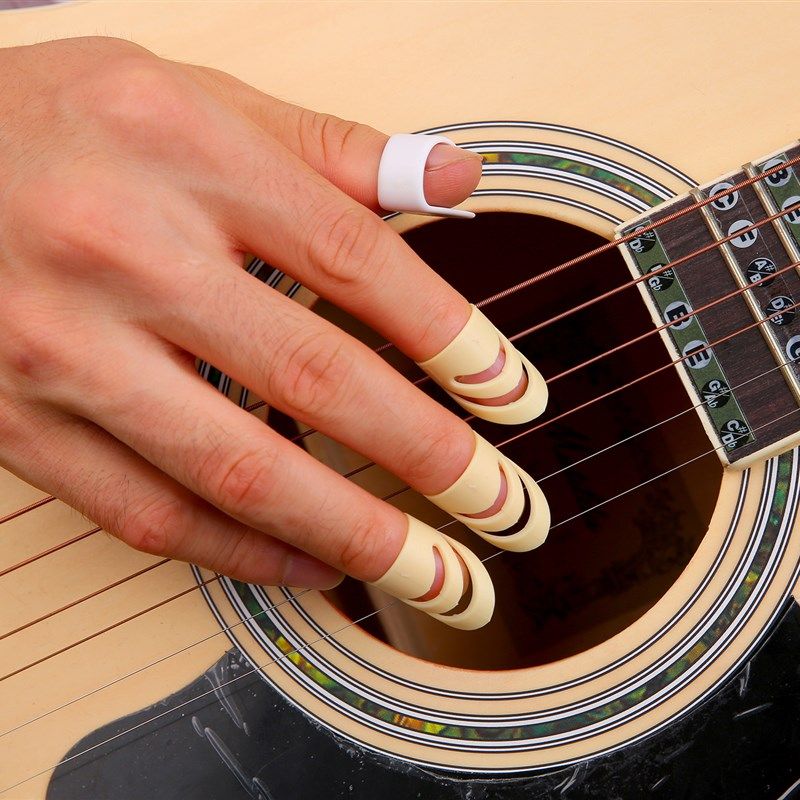 弹吉他右手指套吉他拨片指弹指套吉他拇指拨片 吉他指甲套 包邮,乐器/吉他/钢琴/配件,拨片/拨片套,淘宝优惠券,粉丝福利购,淘宝优惠卷
