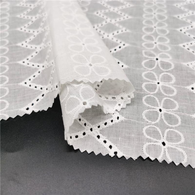 直销新款春夏女装镂空绣花布中高档全棉绣花面料电脑打孔镂空刺绣