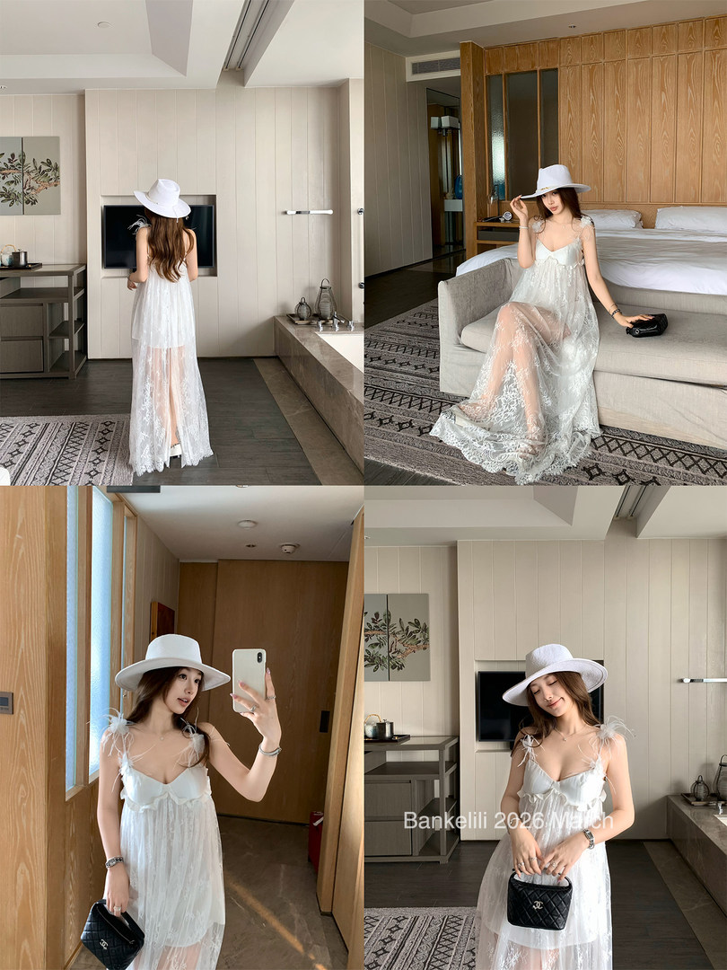White sheer lace maxi dress worn by a model with a wide-brim hat