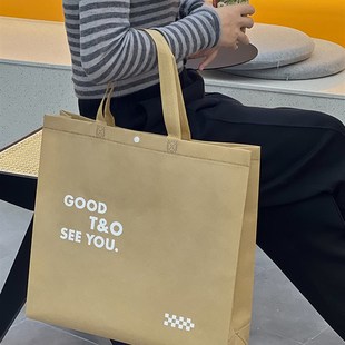 卡其色不织布手提袋定制LOGO大容量装衣K服袋子好点的服装店环保