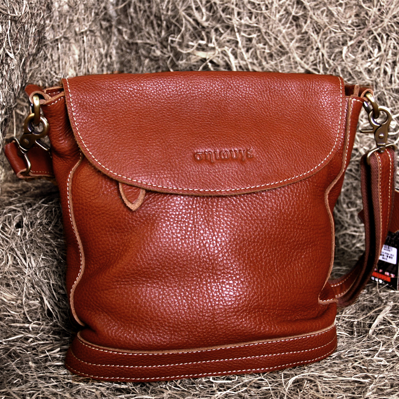 藏皮客正品女包头层牛皮隔层复古黑色斜挎包女真皮棕色翻盖水桶包