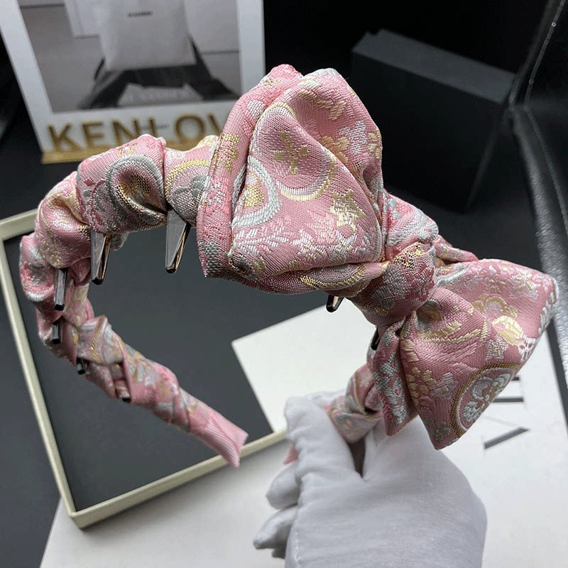 粉色蝴蝶结带齿防滑发箍