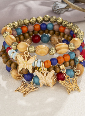 新款时尚波西米亚风多层木珠串珠手链女士创意蝴蝶吊坠分层手链