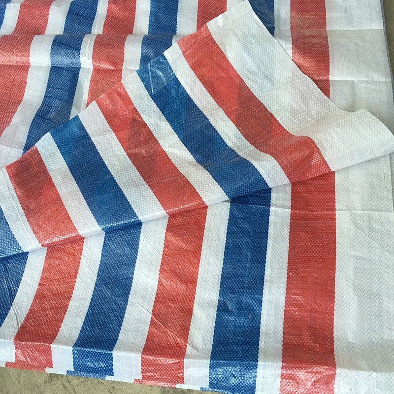 厂家生产单模彩条布65克工地用布PE防尘塑料红白蓝S三色布2-12米