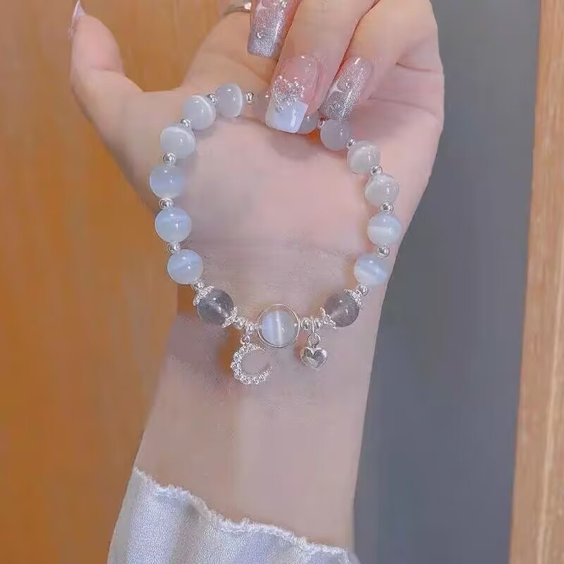 ins灰月光猫眼石手链女简约铃铛吊坠闺蜜生日同款