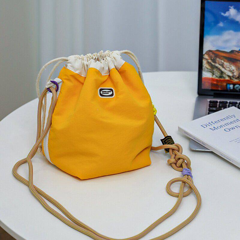 棉道尼龙防水束口收纳袋防撞相机包旅游斜跨化妆包女多功能收纳包