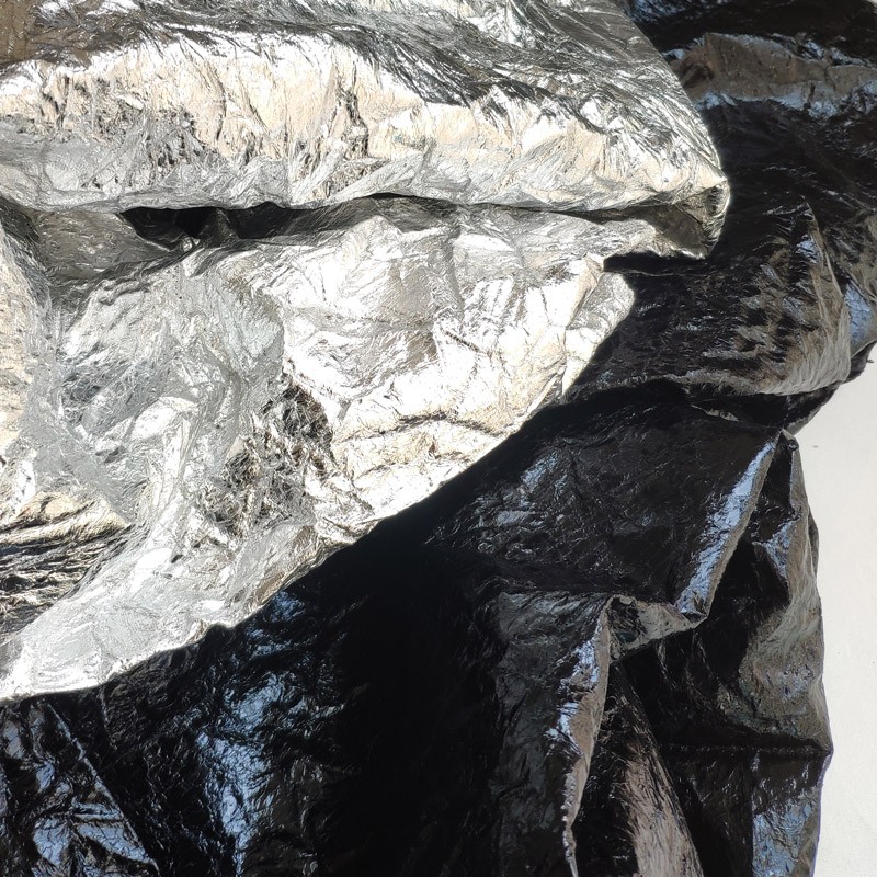 褶皱立体感强肌理皮革布料烫金反光亮面仿皮面料服装毕业设计师布