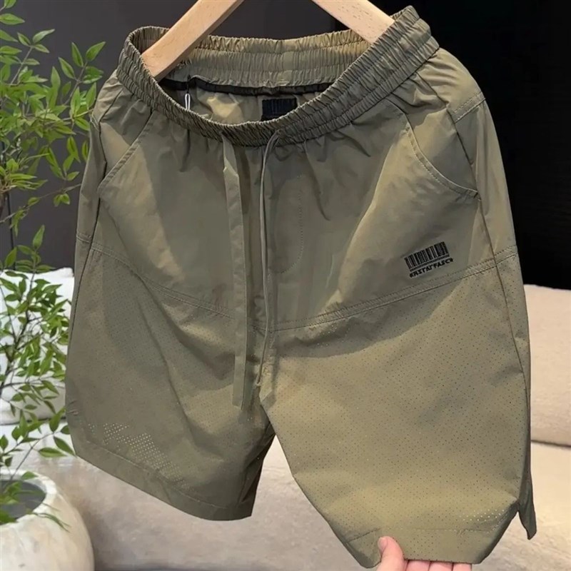 爆款202d5夏季新款休闲短裤时尚男士中裤激光打孔休闲裤子时尚潮