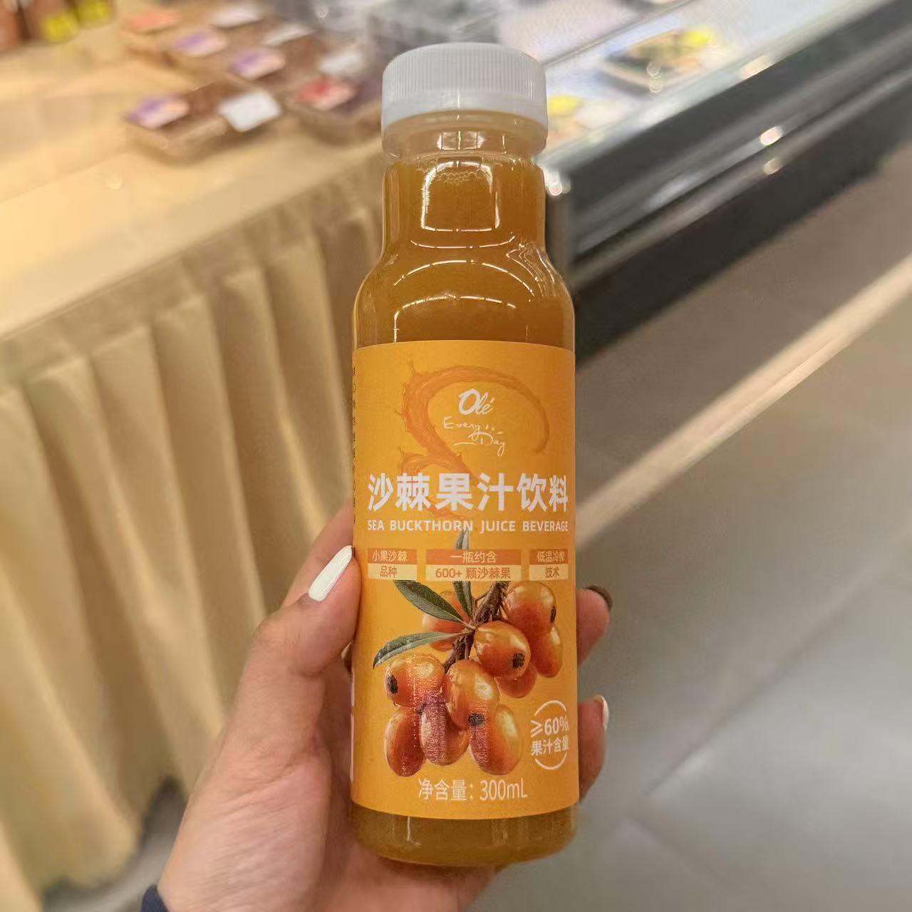 ole超市沙棘果汁饮料300ml瓶装含有果肉图片