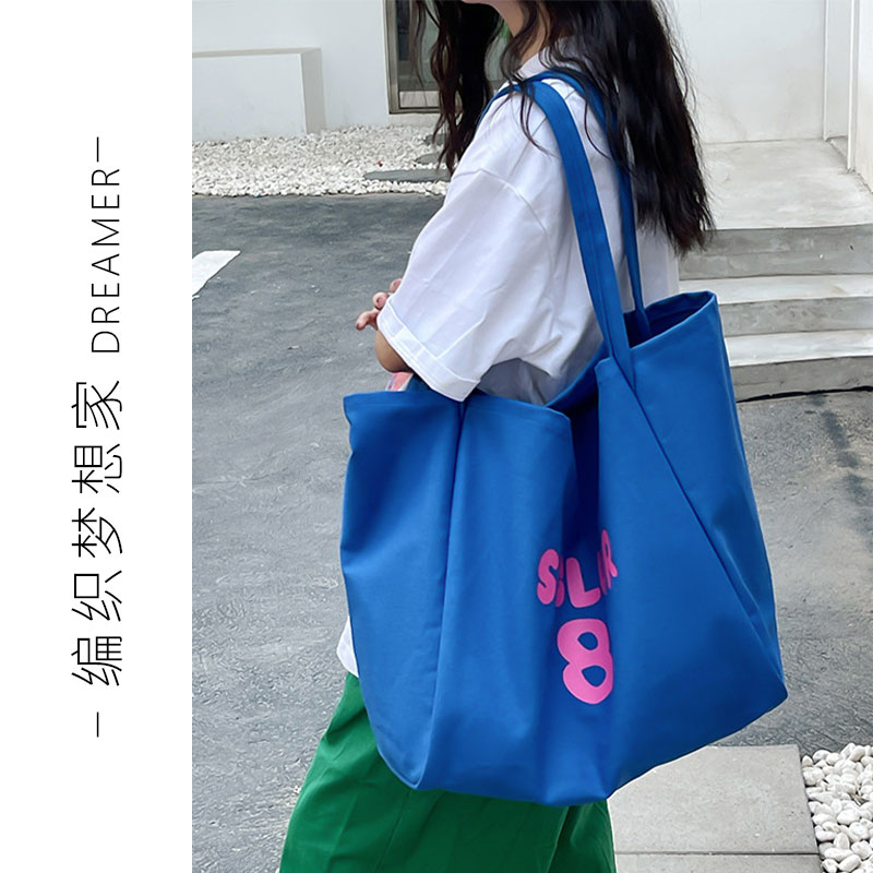 韩系慵懒风简约字母帆布包女2025春夏新款高级感大容量单肩手提包