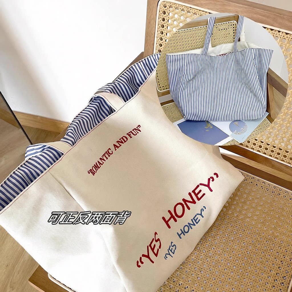 韩版简约条纹刺绣双肩包帆布包耐磨学生正反两用大容量通勤包