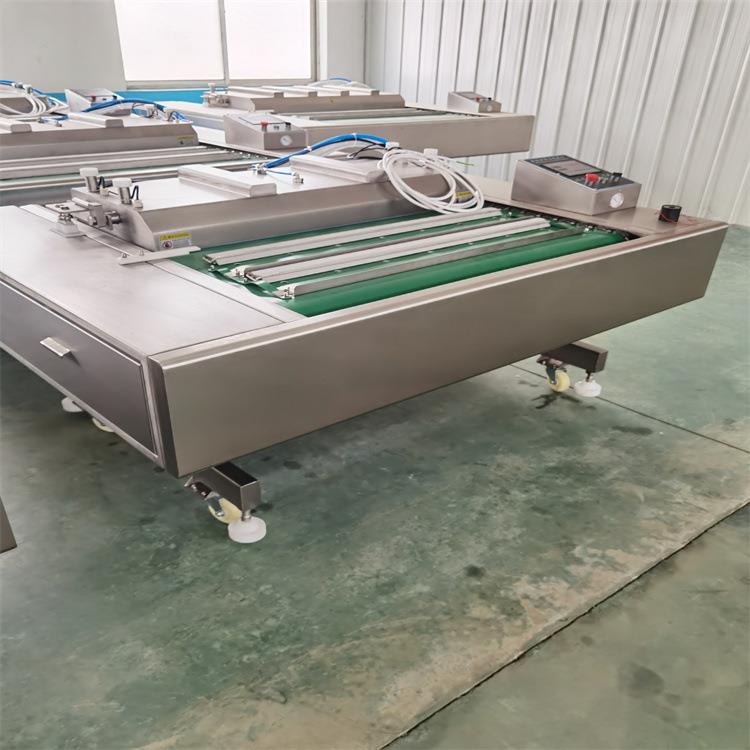 烧鸡烧鸭全自动连续式真空封口机多功能滚动式真空包装机源头厂家