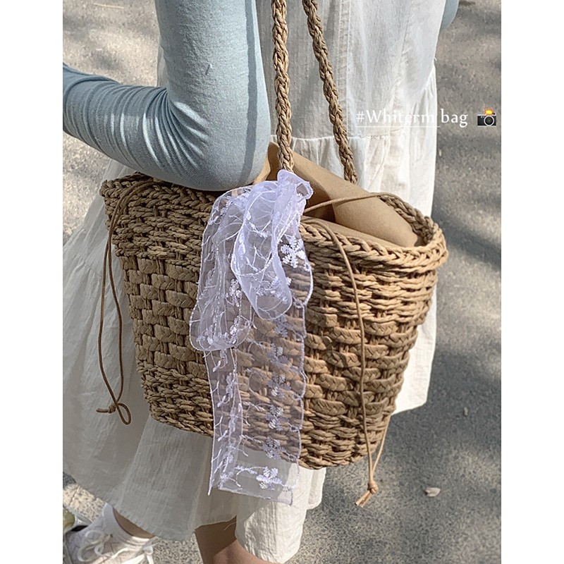 大容量包包女式2024新款夏天小众时尚草编水桶包百搭编织单肩包