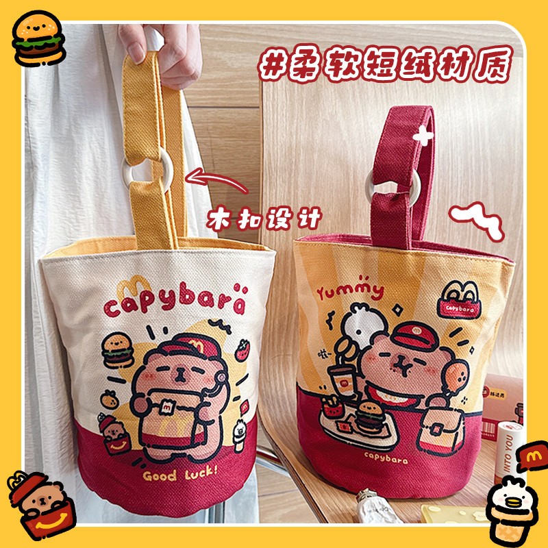 M记卡皮巴拉帆布包水桶包上班杂物小拎包便携通勤迷你手提袋新款
