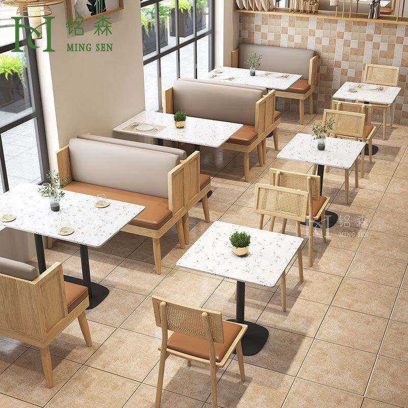 主题餐厅靠墙卡座沙发水磨石桌藤编椅商用饭店餐饮西餐厅桌椅组合