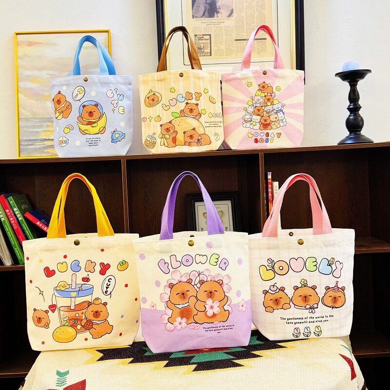 卡皮巴拉水豚帆布水桶包女生日便当包小号手拎包可爱便携手提布袋