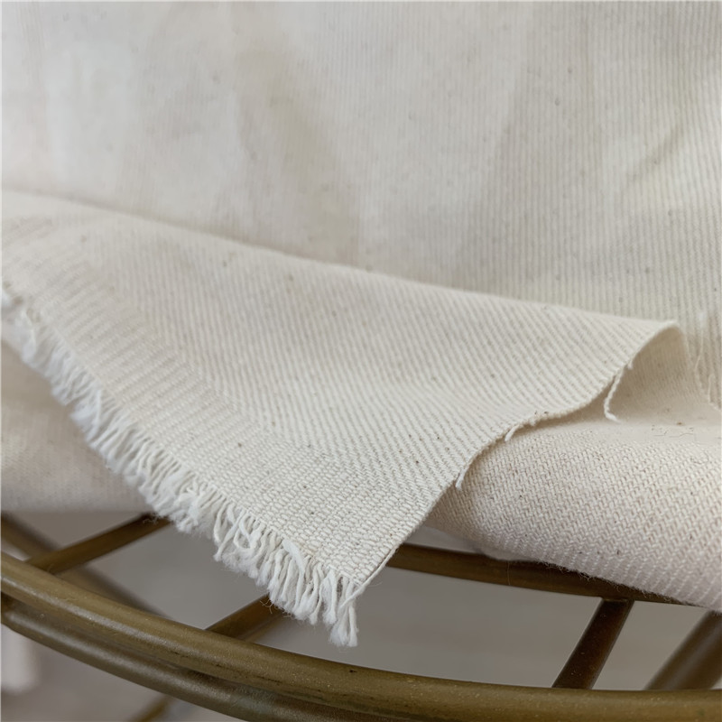 原色未染色纯棉布料斜纹纱卡 有棉籽 夹克服装面料棉花籽