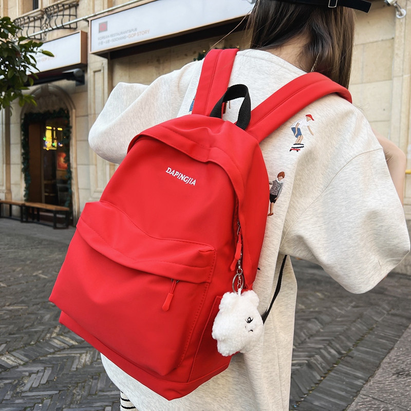 红色书包女2024l新款双肩包大学生大红色红背包轻便旅游肩包男男