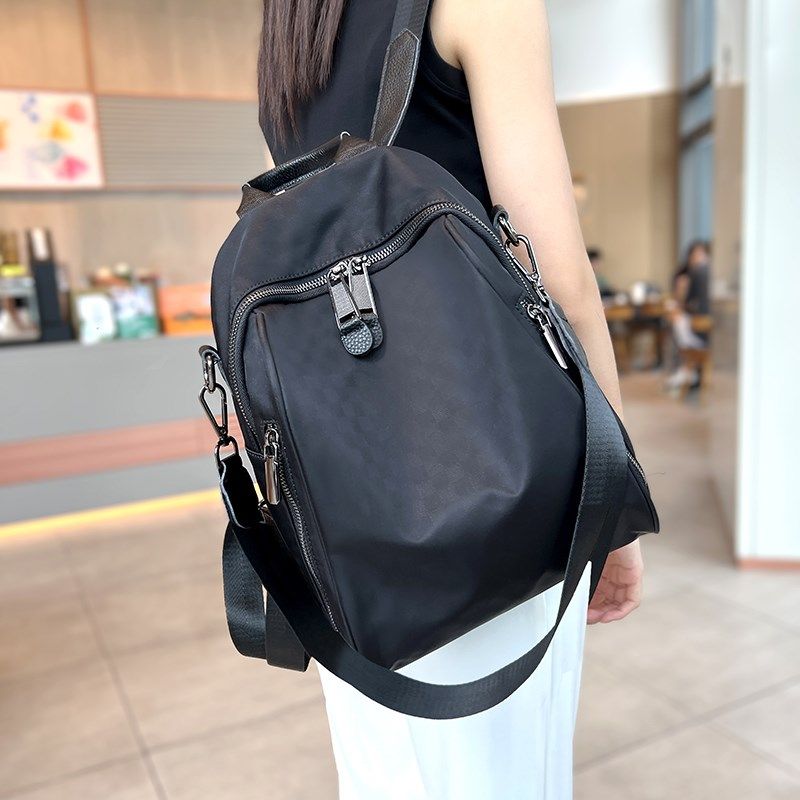 休闲轻便中号双肩包女2024新款防水百搭牛津布背包印花潮流两用包