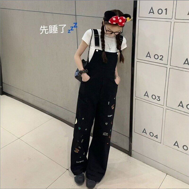 黑色重工童趣刺i绣牛q仔背带裤女春夏季新款宽松显瘦连体直筒阔腿