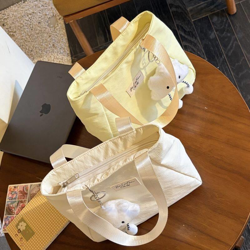 可爱手提包2026新款女包日系简约化妆包迷你上班通勤休闲手拎小包