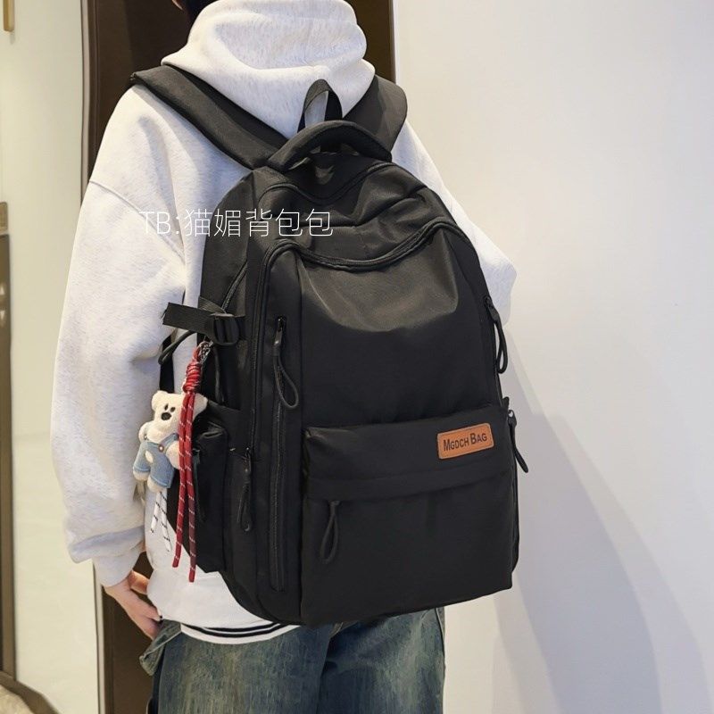 高中生书包2024新款男生潮流黑色双肩包女旅游轻便大容量电脑背包