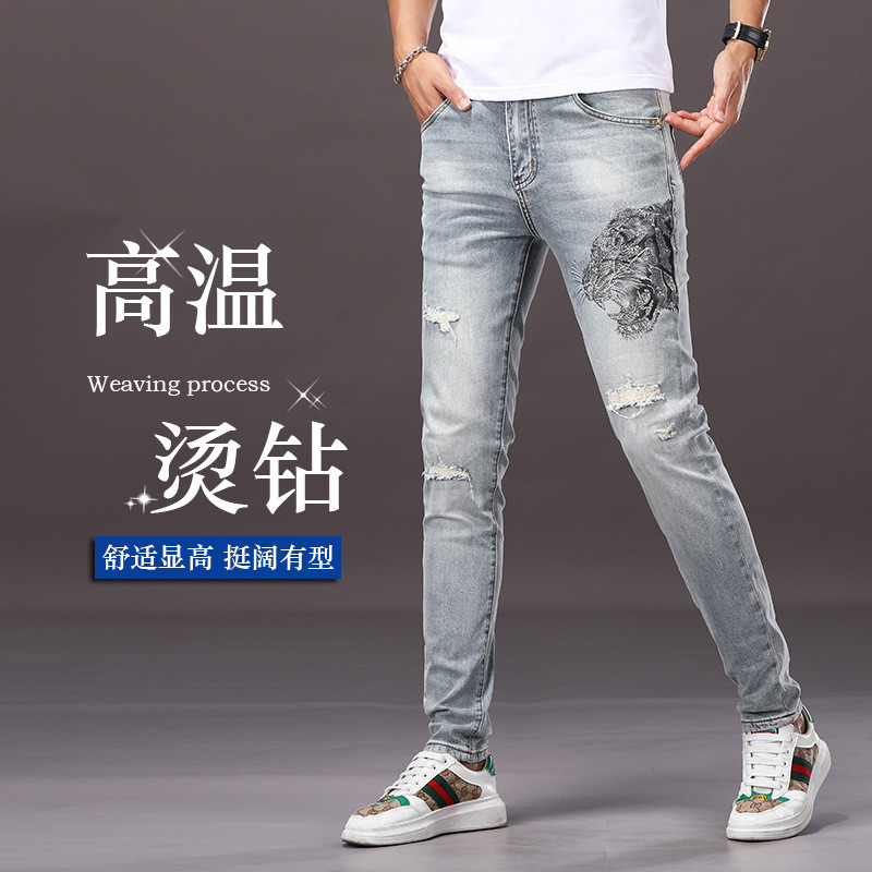 高端欧货烫钻弹力新款牛仔裤男款潮牌修身小脚帅气破洞休闲长裤子