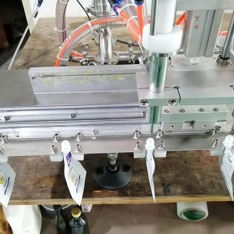 自立袋吸嘴袋小型灌装机 洗衣液洗洁精半自动气动膏体定量灌装机