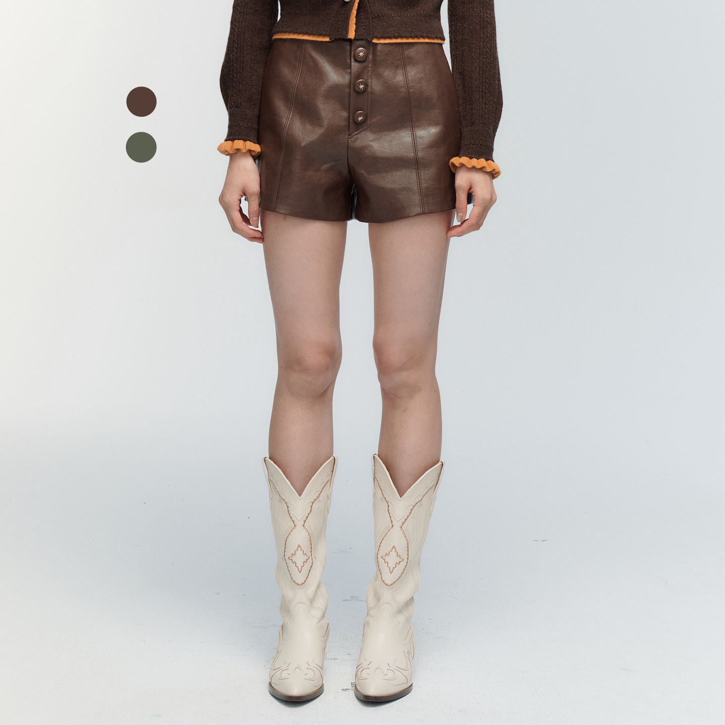 ORA GENESIS2025年冬季新品时尚星芒扣装饰PU皮短裤