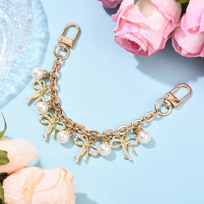 仿珍珠蝴蝶结金属斜挎包链条