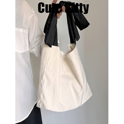 Cute Kitty韩国设计师蝴蝶结简约单肩帆布包学院风大容量购物袋