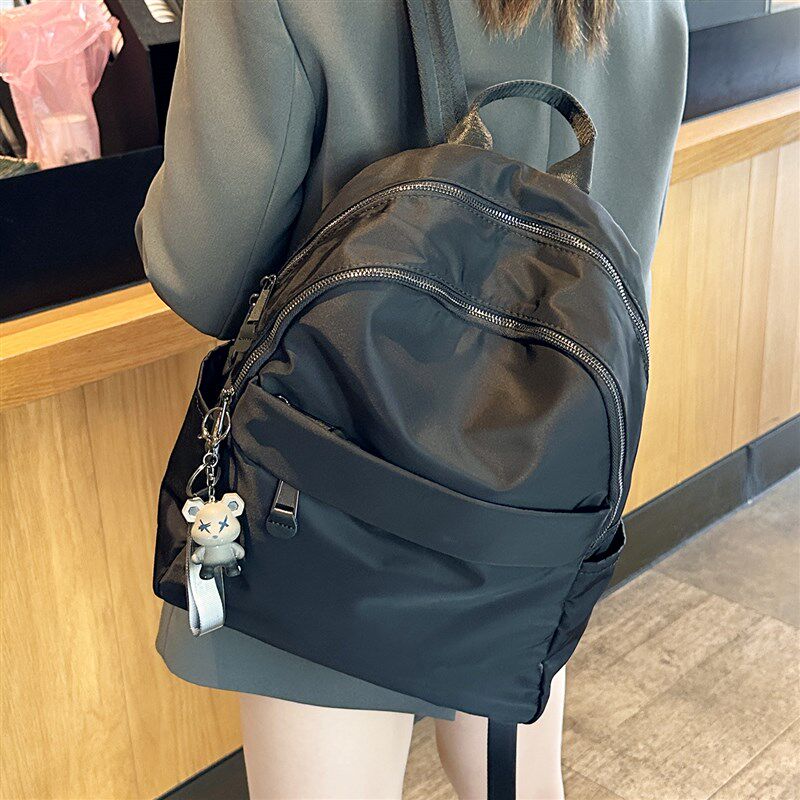 防水后揹包女2h025新款时尚电脑包牛津布通勤出游登山包轻便揹包