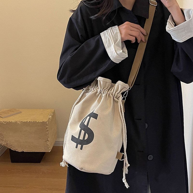 抽绳双肩包女休闲街头潮流斜挎包多用功能帆布水桶包通勤学生背包
