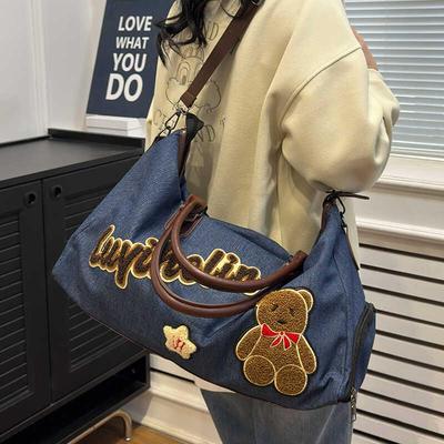 新品牛仔布旅行包女短途旅