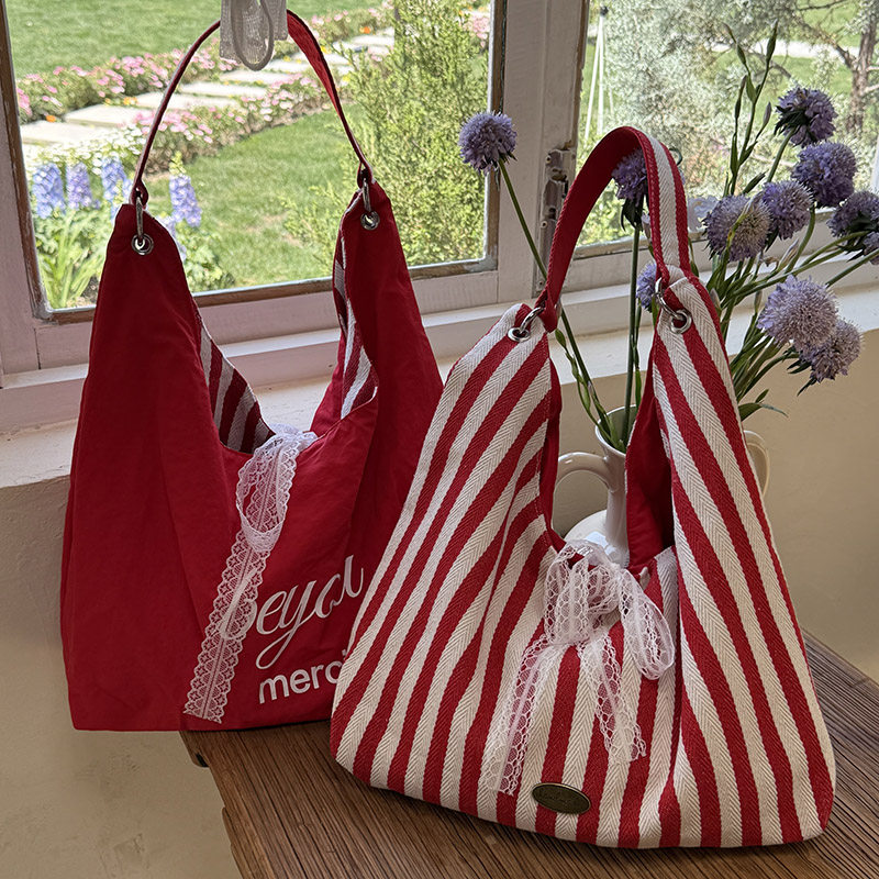 条纹帆布包包女夏天2025新款潮韩国字母印花双面单肩包学生上课包