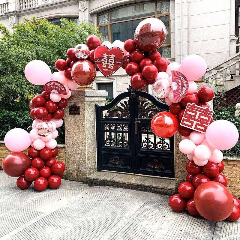 结婚拱门室外农村路边装饰气球引路红色带囍字婚庆酒店场景布置