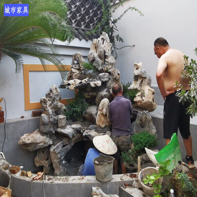 成都花园鱼池假山设计施工假山现场制作鱼池吸水石太湖石好看