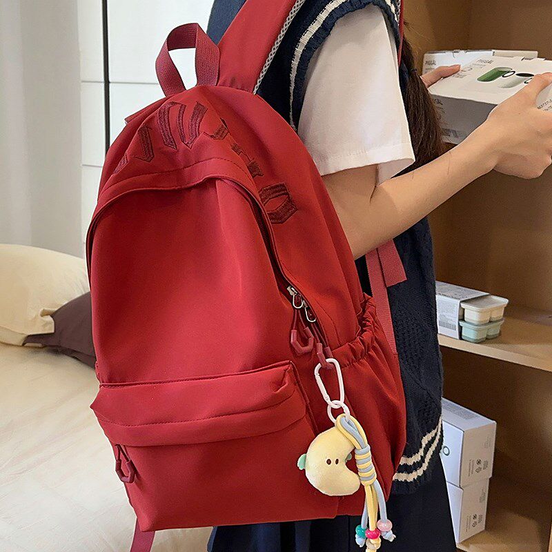 简约纯色双肩包女2025新款潮百搭大学生书包轻便休闲短途旅行背包