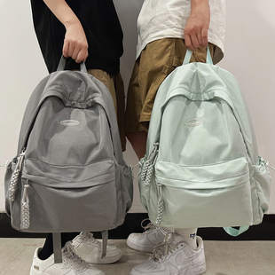纯色麦穗书包女生大学生大容量轻便减负双肩包男简约百搭黑色包