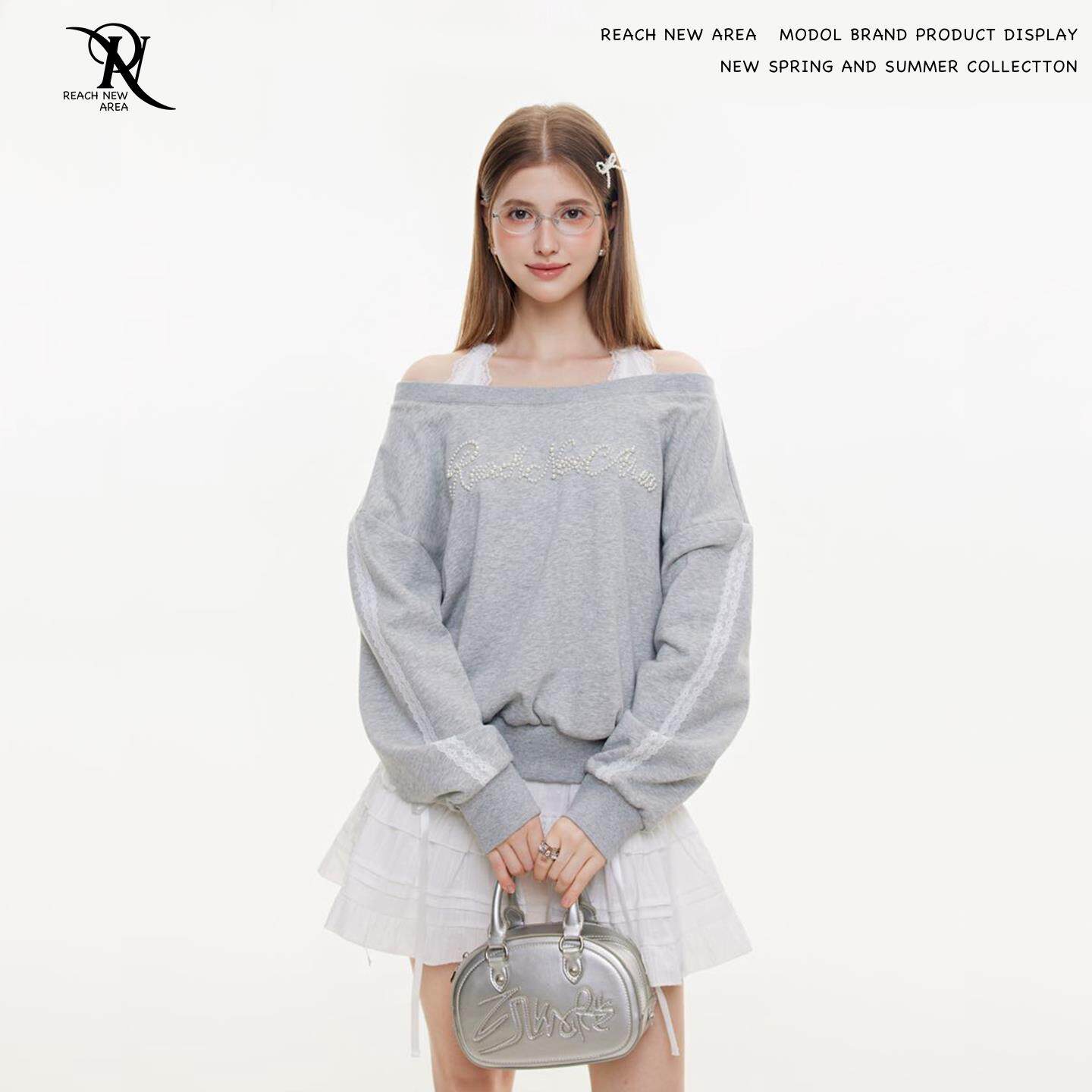 REACH原创春秋新款钉珠卫衣女斜肩长袖宽松假两件套头露肩上衣服