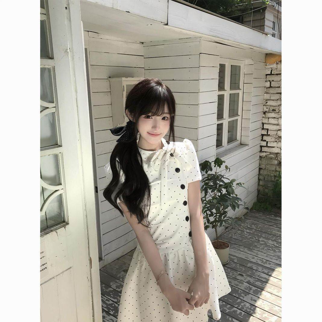 韩系小众波点蝴蝶结A字连衣裙女2026夏季新款显瘦褶皱设计感裙子