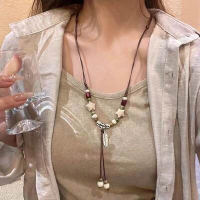 纯白星羽新中式陶瓷长款毛衣链