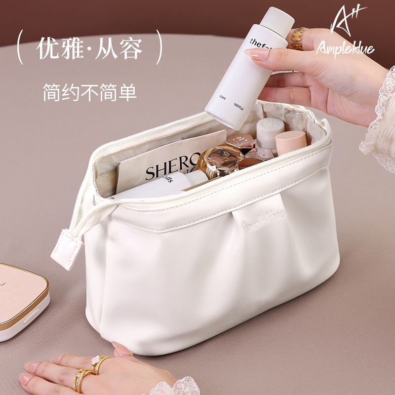 化妆包女2025新款便携式分区收纳外出手抓包收纳大容量轻奢高级