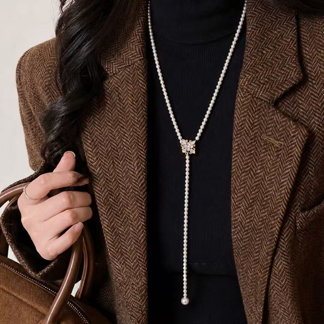 金色珍珠仿钻羽毛长款毛衣链女