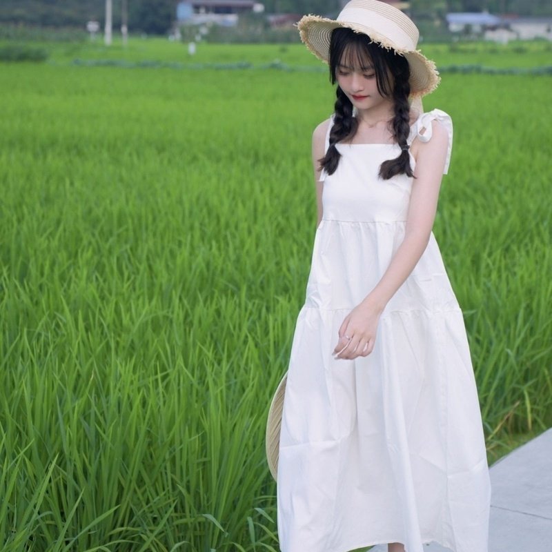 夏季初恋白色吊带2026连衣裙新款法式蝴蝶结甜美长裙温柔裙子