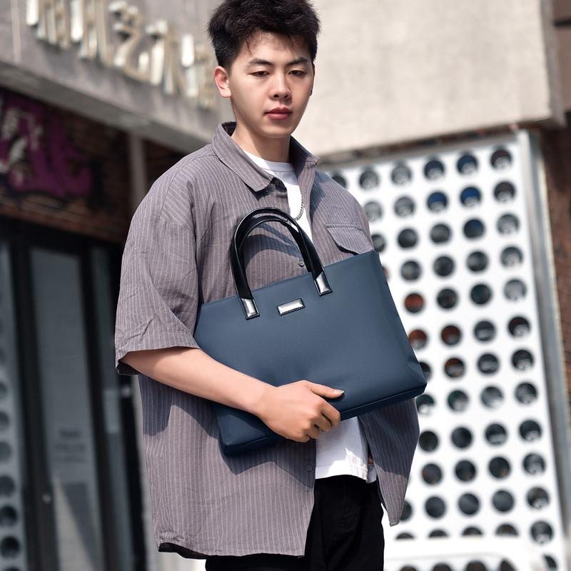 商务会黑色PU牛手提议包定做津布文件包印ogo横款lV拉炼公文包订