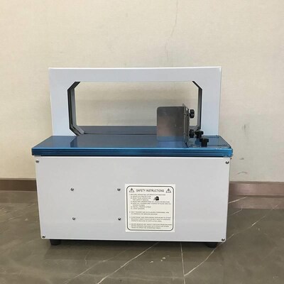 深圳自动纸带束带机 小型opp带自动打包机智能小热熔捆扎机