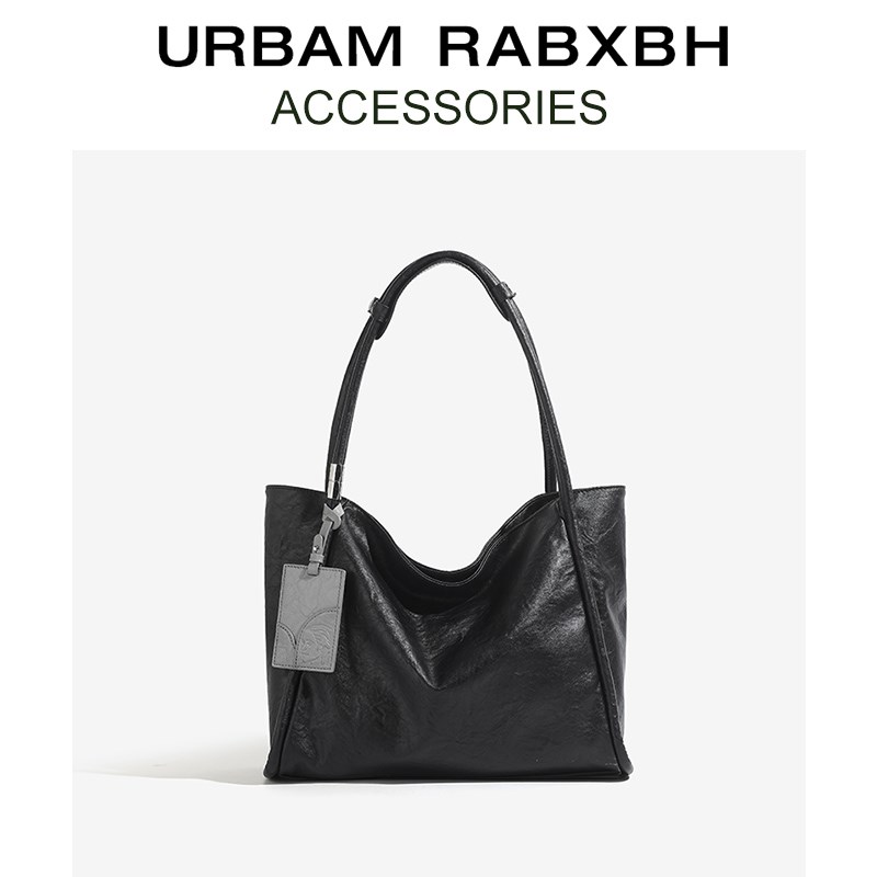 小众设计真皮黑色大容量托特包女2025新款春季通勤单肩包腋下大包