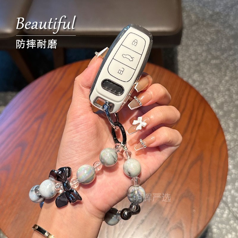 适用23款车钥匙套A6LA7LzA8/Q4甜酷黑壳少女心粉色扣包